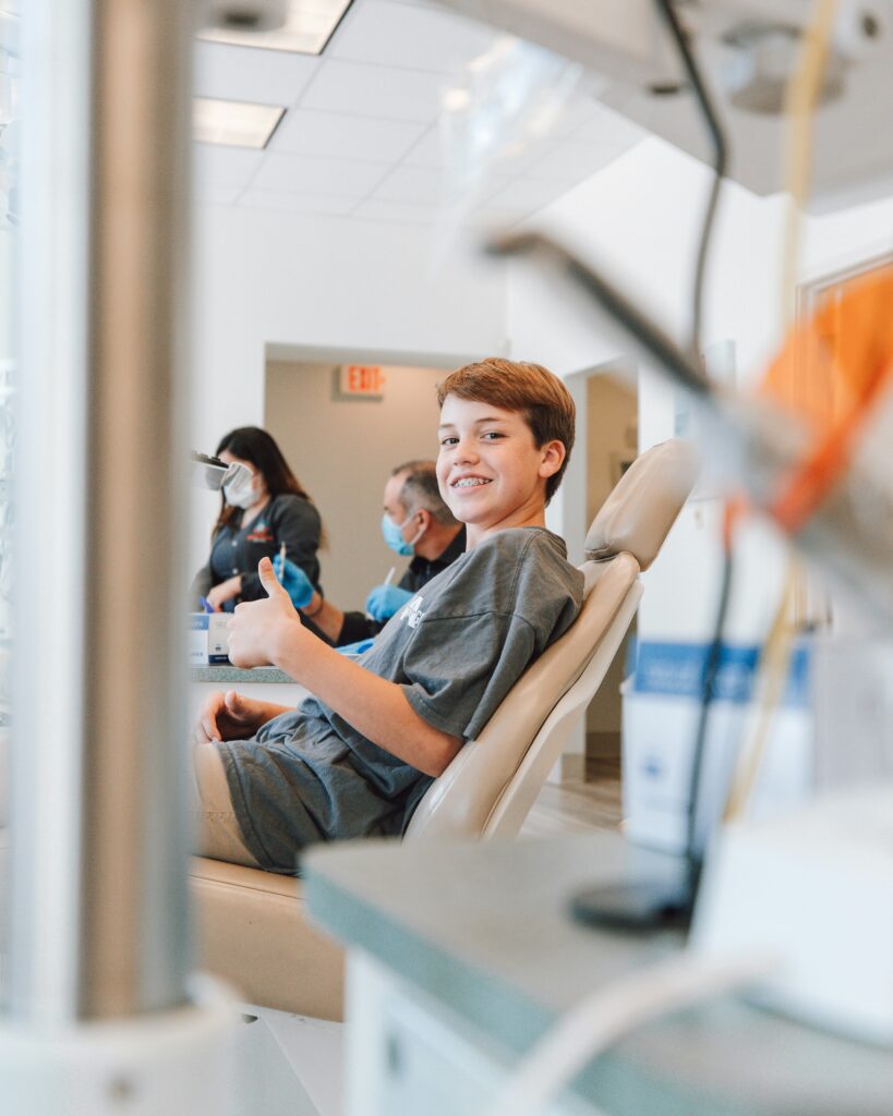 A young patient relaxed in the chair during a new patient exam at Lumino Dental in Langley, BC
