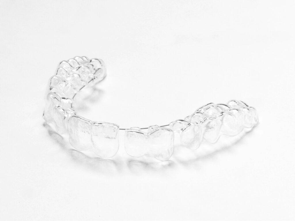 A custom clear night guard made at Lumino Dental in Langley, BC